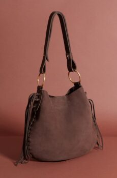 A simple dark brown leather shoulder bag with a shoulder strap and tassels on both sides of the closure