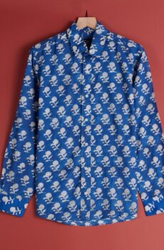 A royal blue long sleeved button up shirt with white patterning