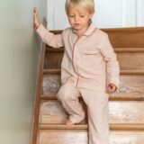 Kid wearing red and white pajama set