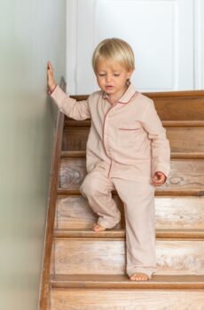 Kid wearing red and white pajama set