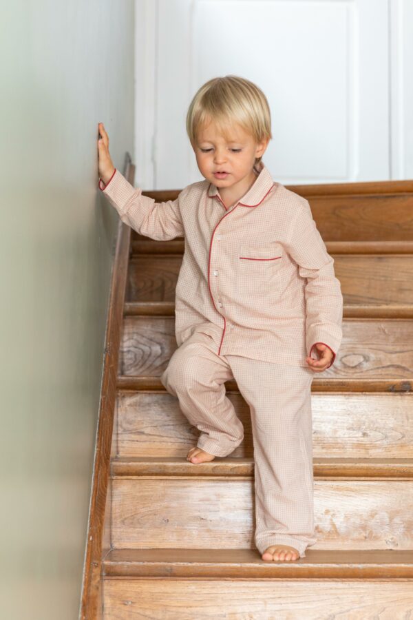 Kid wearing red and white pajama set