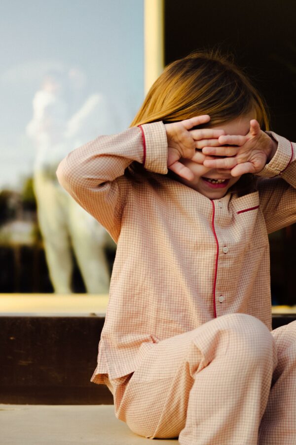 Kid wearing red and white pajama set